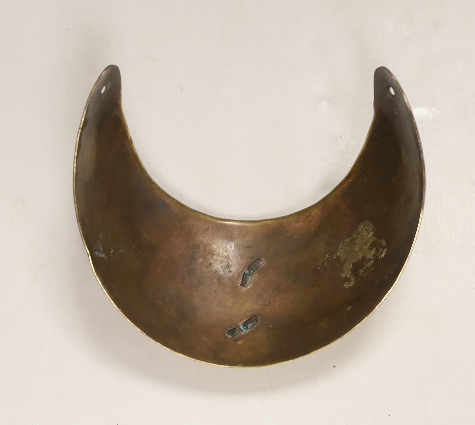 A Royal Fusilliers brass gorget, diameter 12.5cm